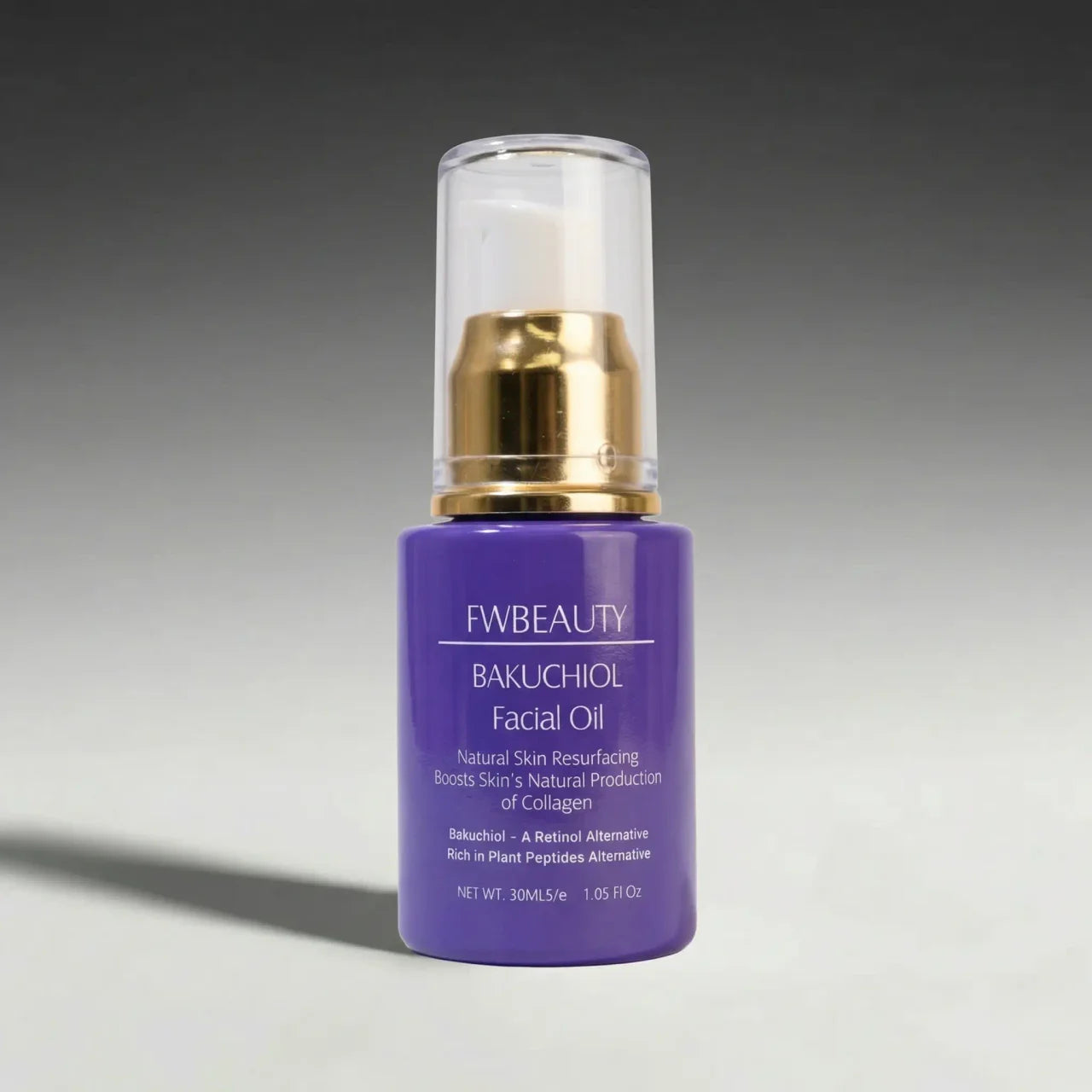 Facial oil bottle with gold cap on a gradient gray background