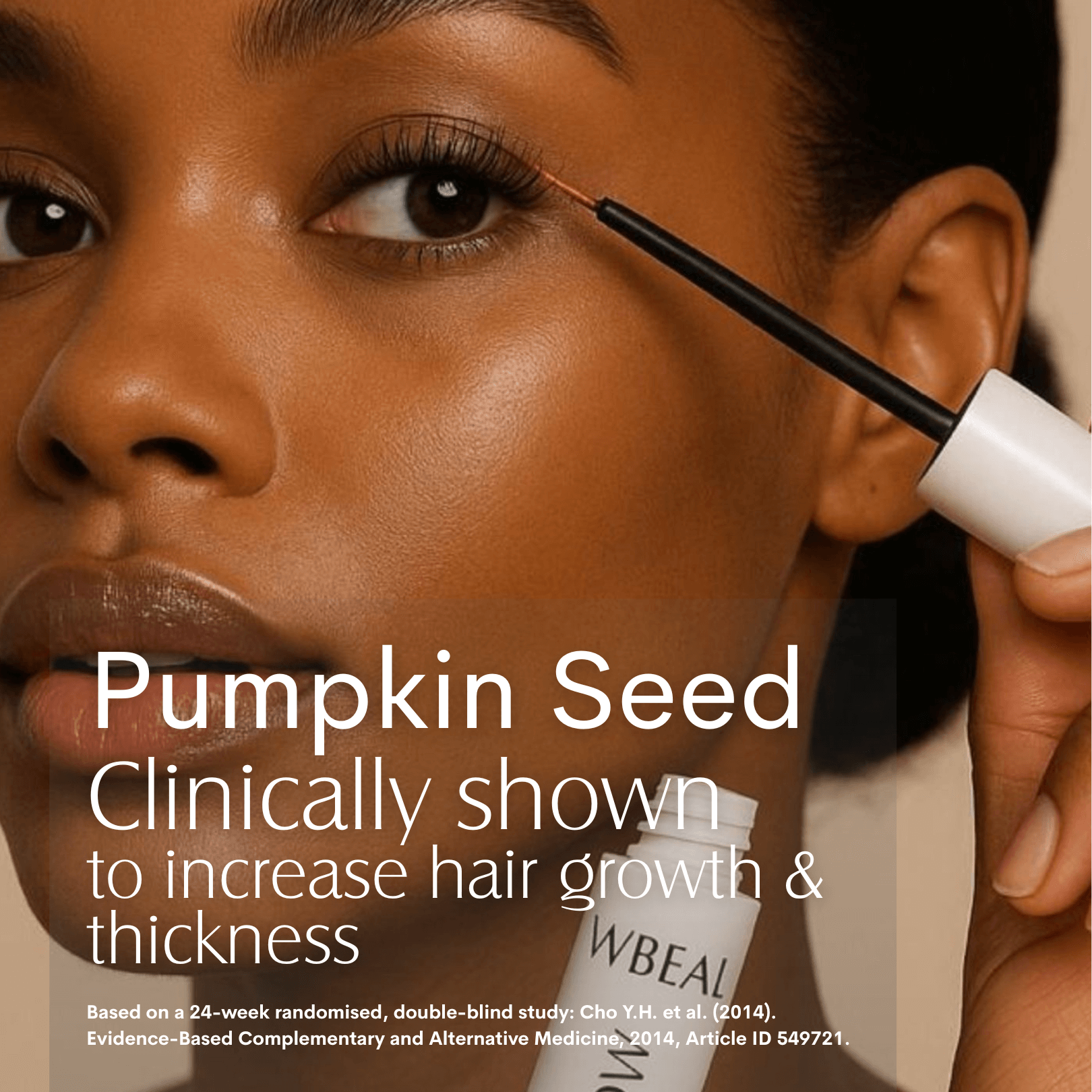 Lash & Brow clinically shown to increase hair growth and thickness. FWBEAUTY
Model head shot, with model displaying use of a product application wand with a black stem and white handle, application its to the eye lashes. 