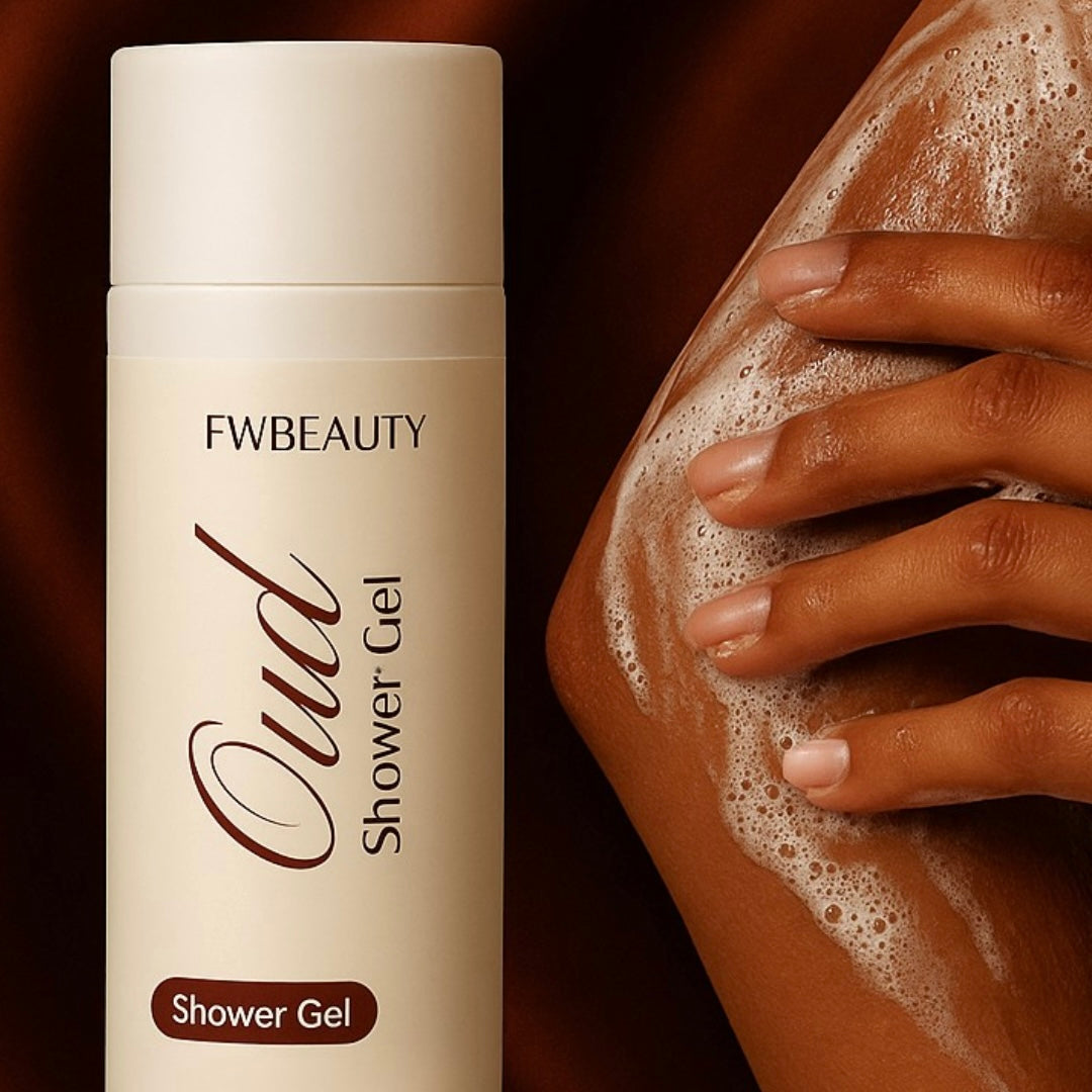 Oud_Shower_Gel_FWBEAUTY
white cosmetic bottle with 'FWBEAUTY' branding.    handles model displaying lathered product on arm, on Red back ground.  