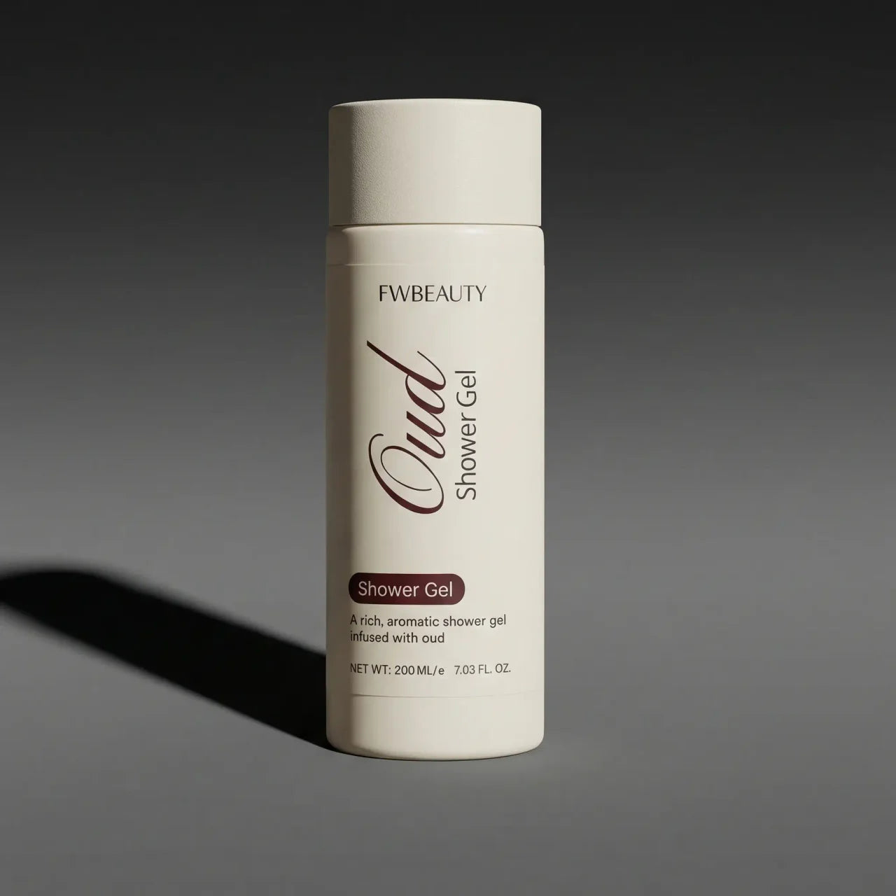 Shower gel bottle with 'FW Beauty' branding on a dark background