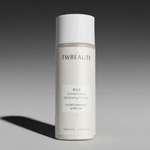 FWBeauty rice conditioning cleansing powder bottle on a gray background