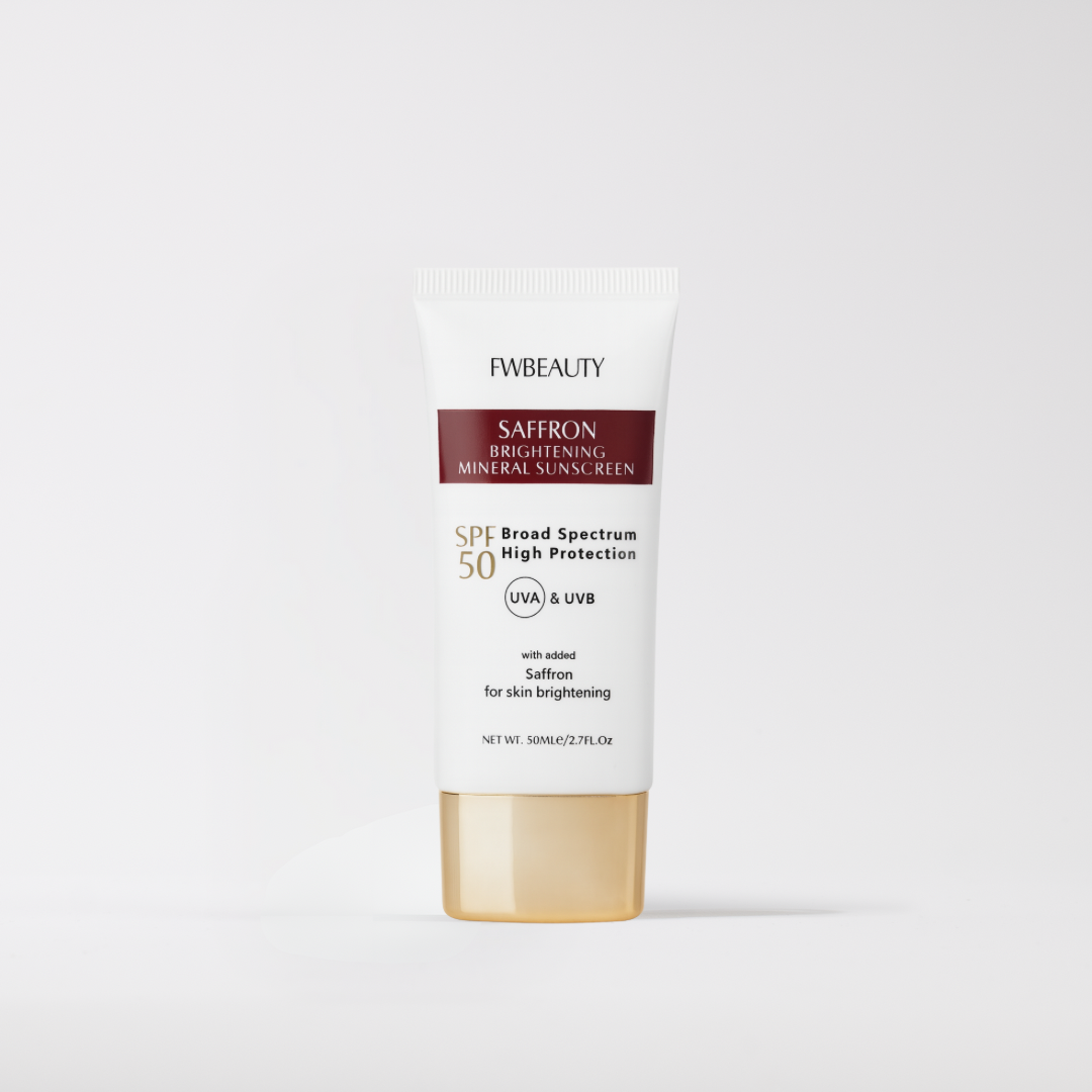 Saffron brightening mineral sunscreen bottle with gold cap on a white background