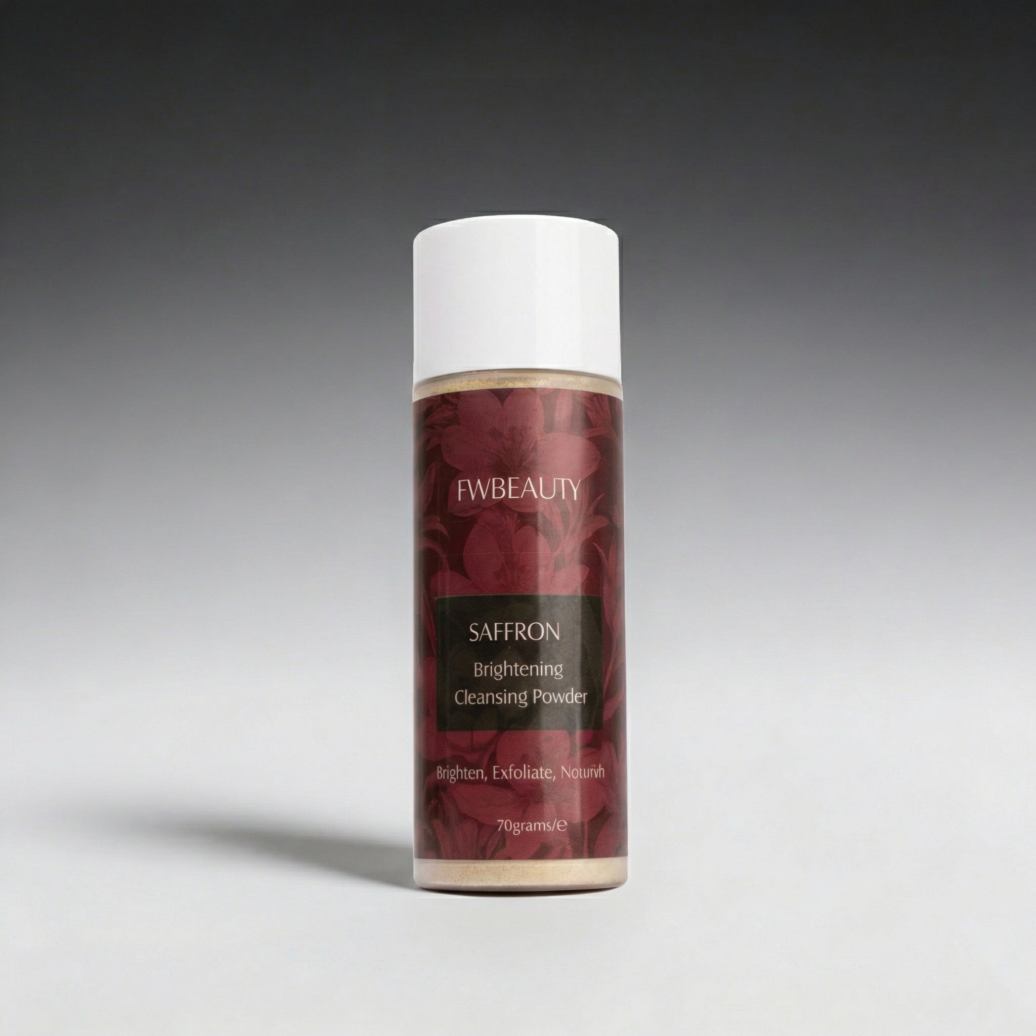 Saffron brightening cleansing powder bottle with red label on gray background