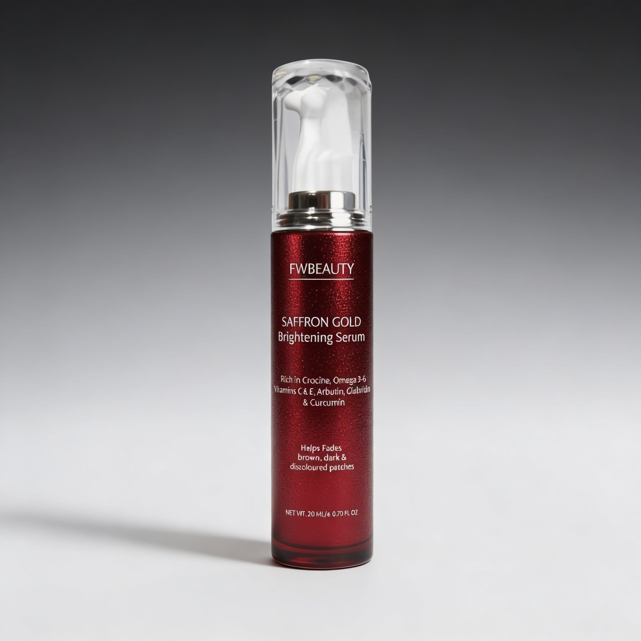 Red serum bottle with silver cap on a gray background