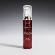 Red serum bottle with silver cap on a gray background