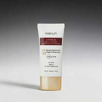Tube of FwBeauty Saffron Brightening Mineral Sunscreen on a gray background