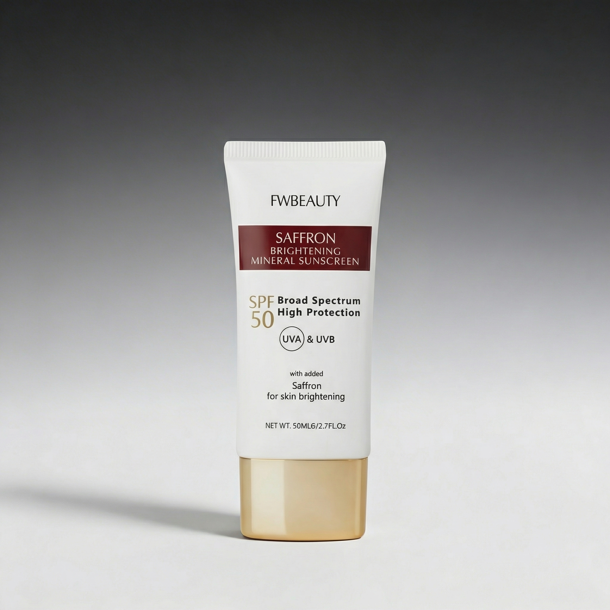 Tube of FwBeauty Saffron Brightening Mineral Sunscreen on a gray background
