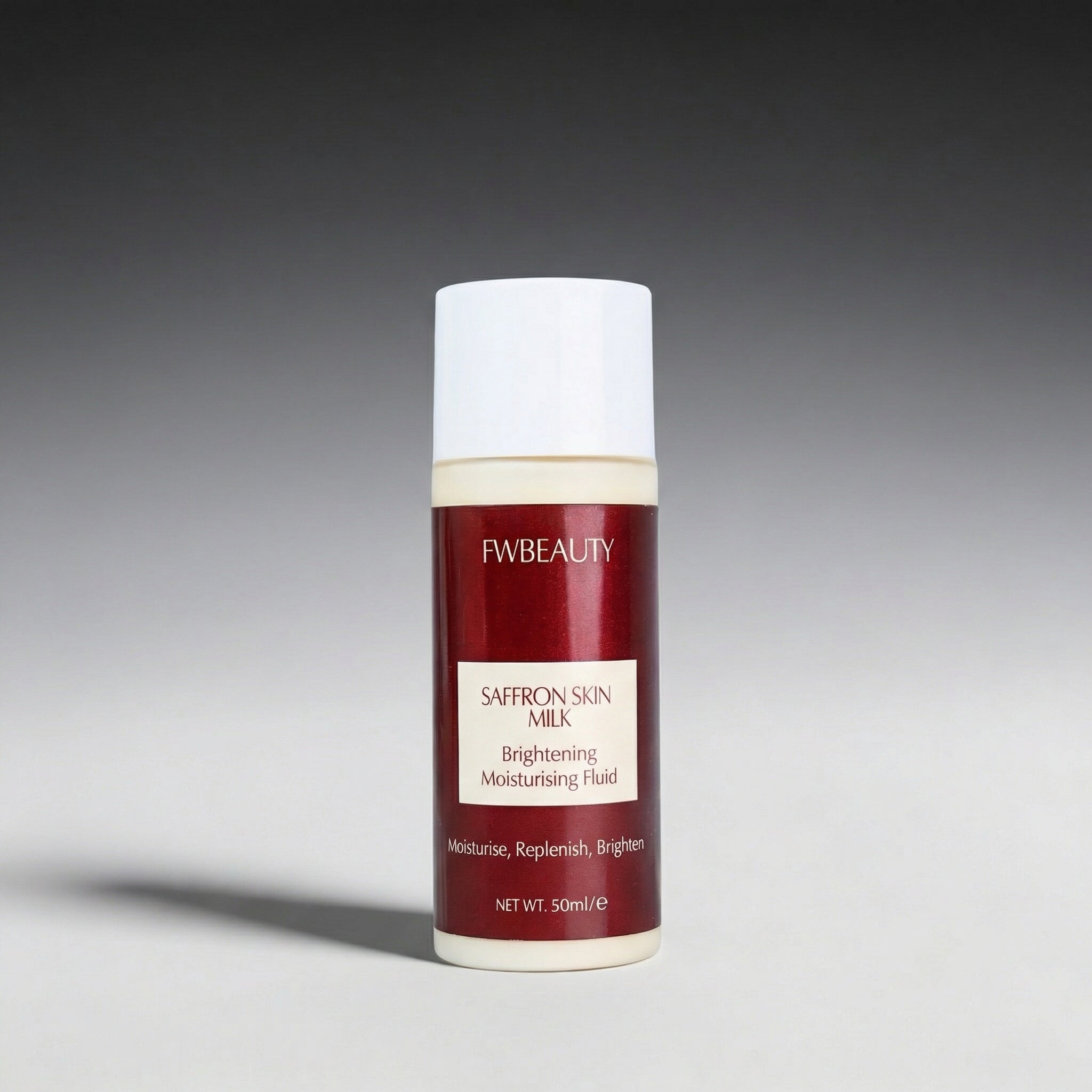 FWBeauty saffron skin milk bottle on a gray background