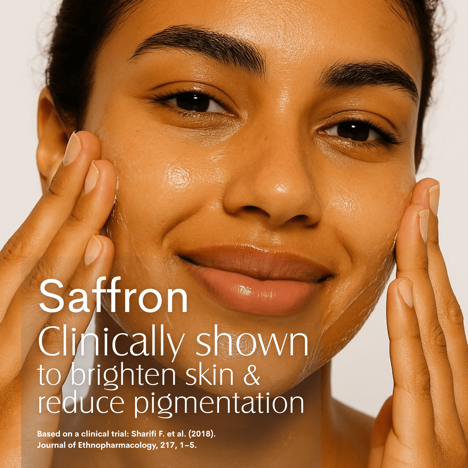 Woman applying Saffron Skin Quench Concentrate on her face