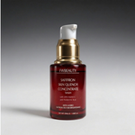 Red serum bottle with gold cap on a gray background