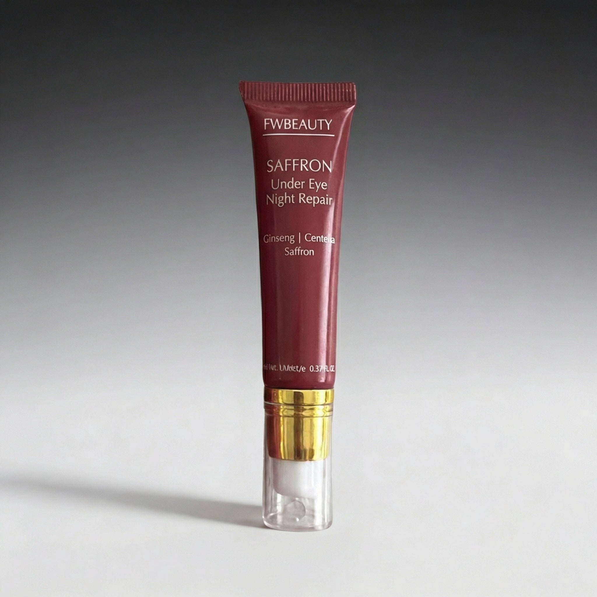 Fw beauty saffron under eye night repair tube on a gray background