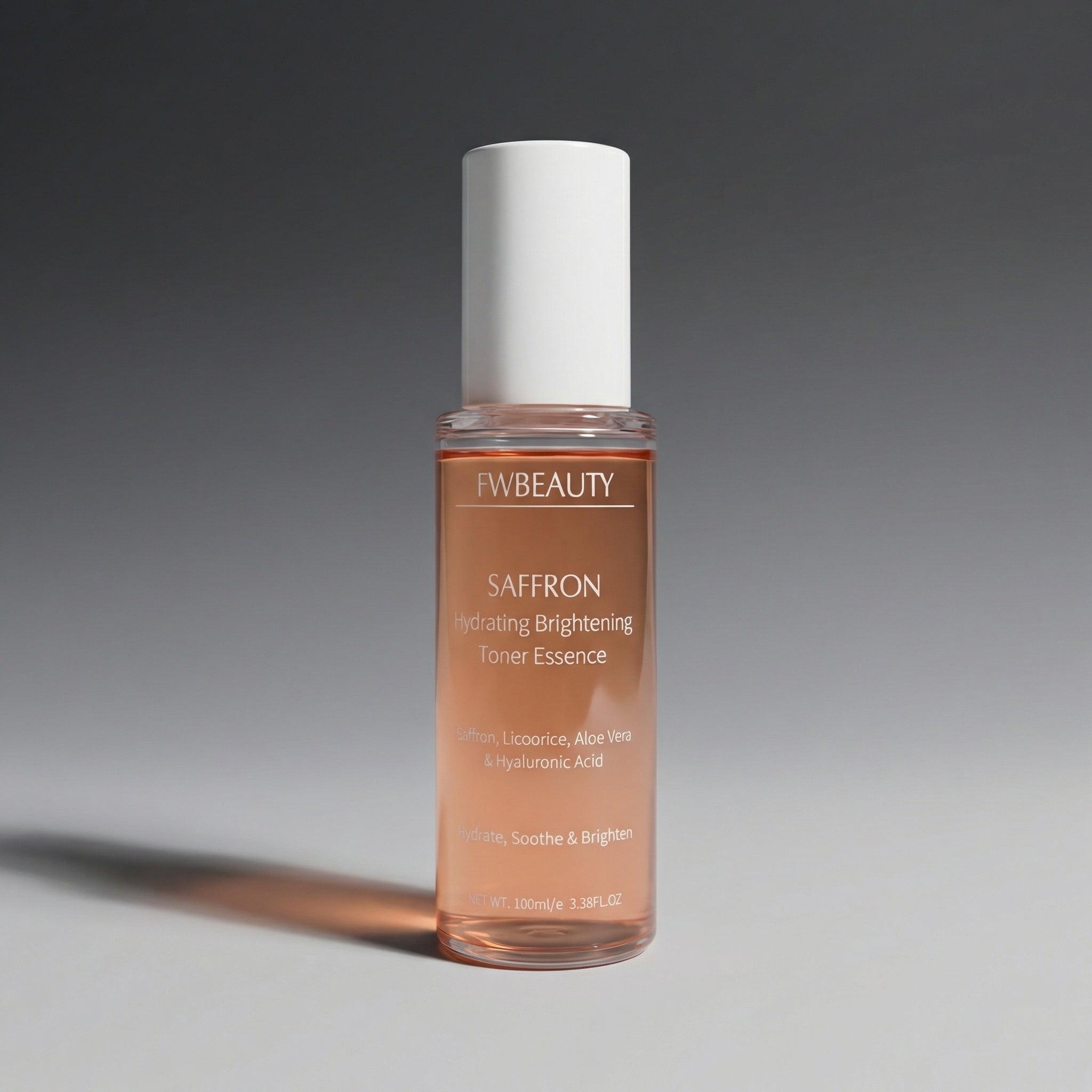 FV Beauty Saffron toner essence bottle on a gray background