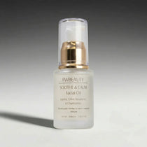 Facial oil bottle labeled 'fwbeauty' on a gradient gray background