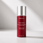 FWBEAUTY Surface Reset Cleansing Powder in a red cylindrical bottle with a reflective silver cap, set against a light gray background with soft diagonal shadows.