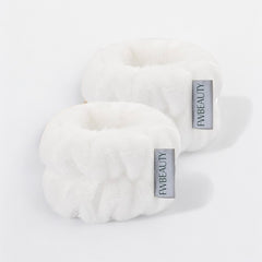 Wristbands FWBEAUTY. 

2 white fluffy wristband with 'FWBEAUTY' branding on a white back ground. 