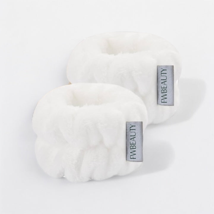 Wristbands FWBEAUTY. 

2 white fluffy wristband with 'FWBEAUTY' branding on a white back ground. 